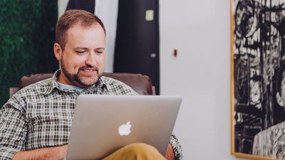 Man Watching Educational Video Content
